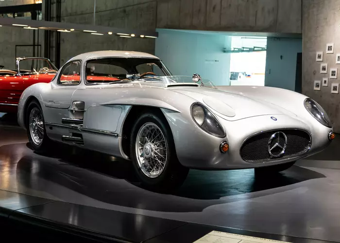 A mercedes sports car on display in a museum