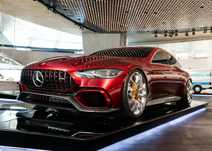 A red car on display in a building